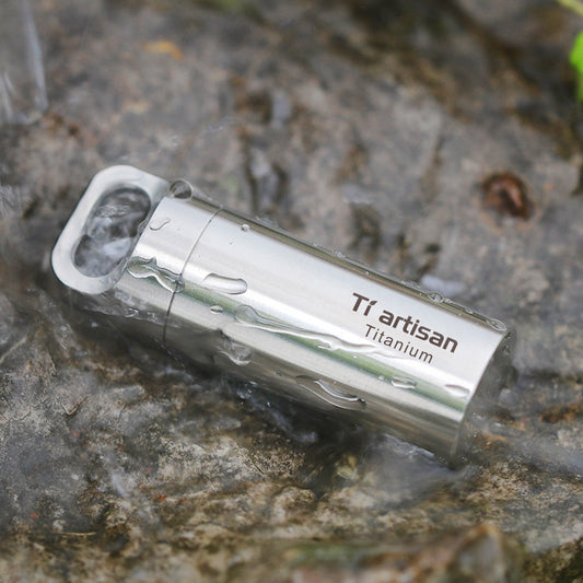 Titanium Keychain Pill Holder inside water 