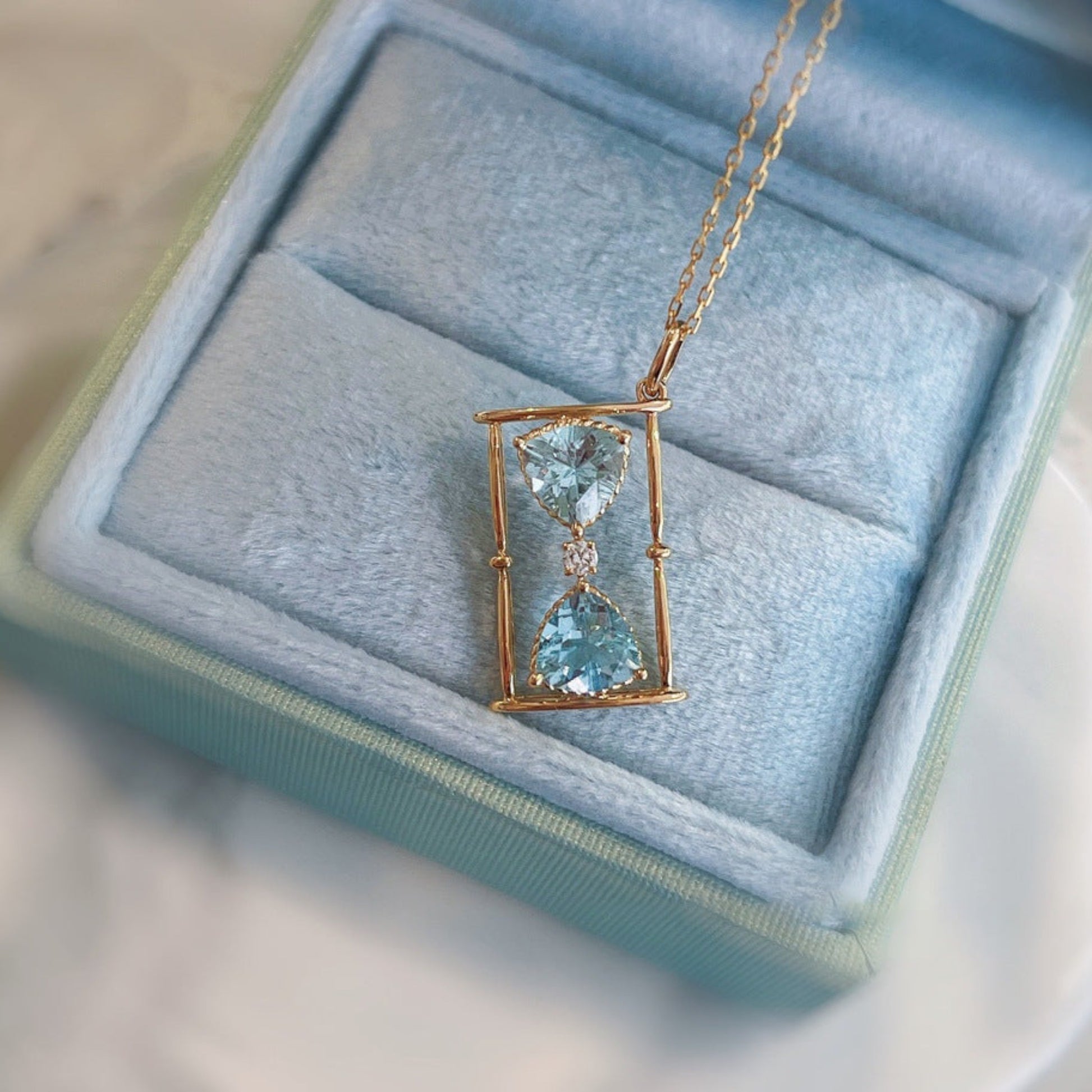 Hourglass Necklace close up in a blue gift box 