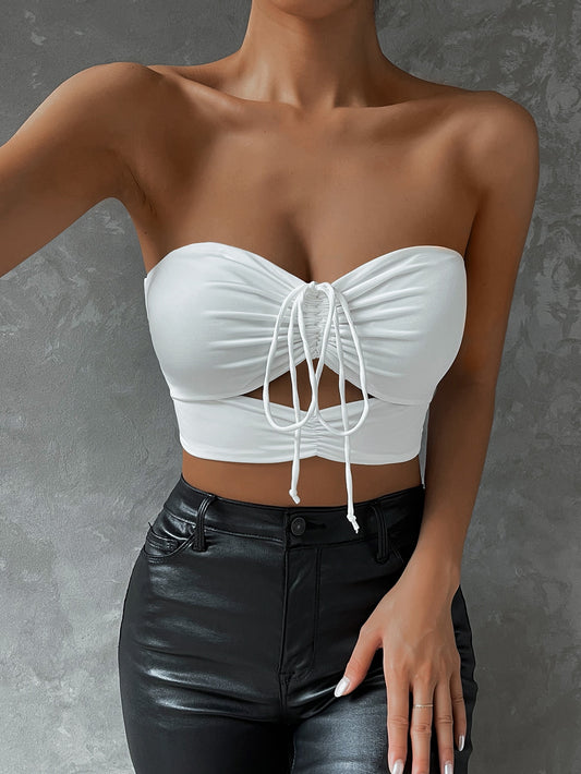 Cutout Mini Top a woman wearing it white color with leather leggings from the front 