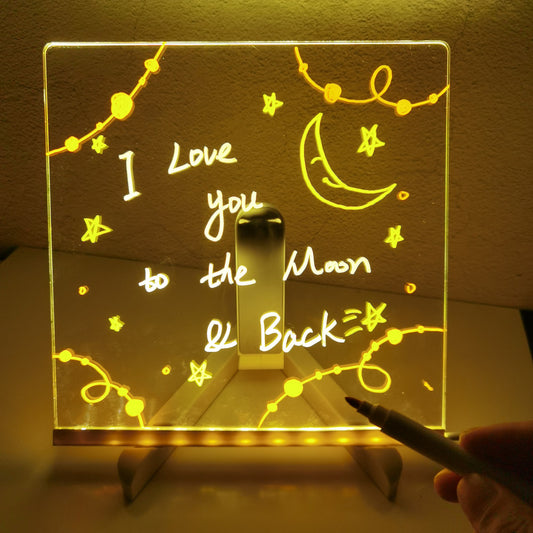 LED Writing Board whritten on it "i love you to the moon & back " 
