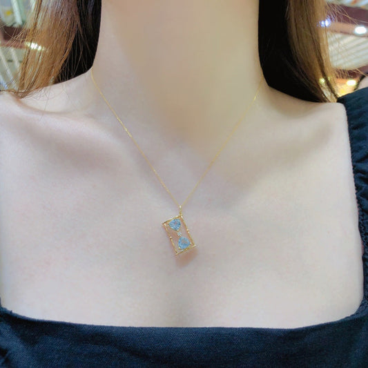 Hourglass Necklace on a women's Neck 