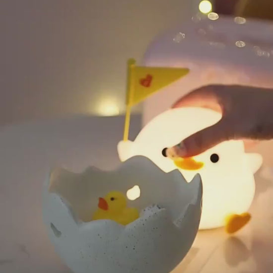 Doudou Duck Night Lamp a video of a someone beating it and putting it in an egg 